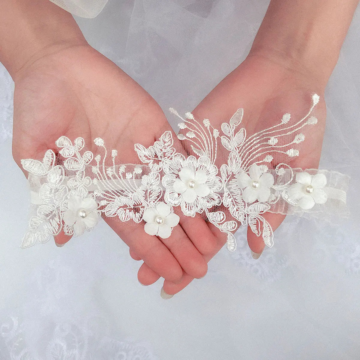 2-piece embroidered bridal garter thigh belt with pearl flower detail and elastic leg loops for weddings or parties