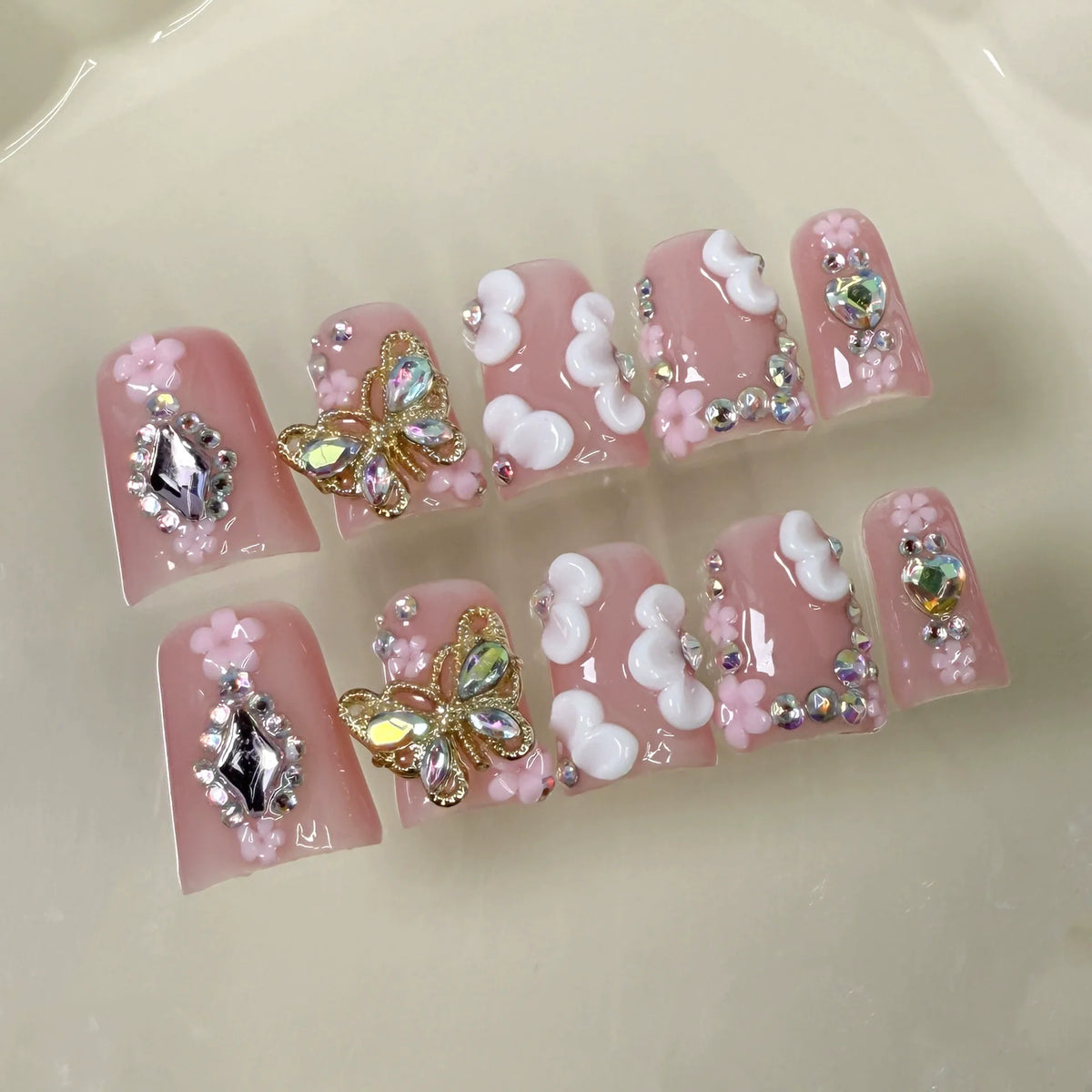 10pcs short duck bill false nails with pink French tips, 3D butterfly flowers, pearl hearts, and rhinestones