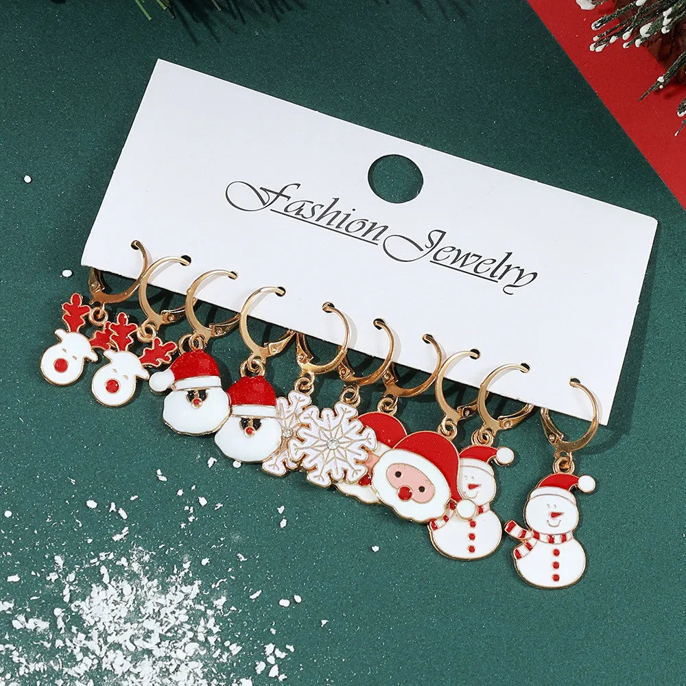 Festive Christmas dangle earrings by HSF Marketplace featuring snowman and elk charms
