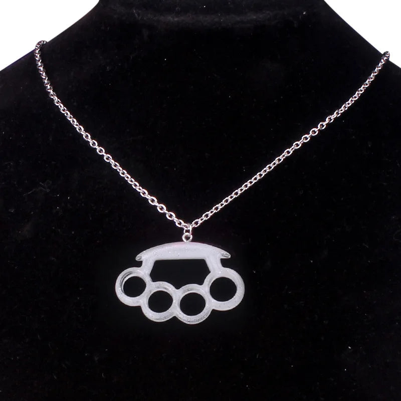 Resin imitation four-finger boxing glove pendant necklace with metal chain, stylish women's jewelry accessory.