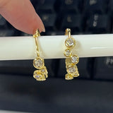 14K gold moissanite bubble hoop earrings by HSF Marketplace, featuring a rounded design and sparkling stones