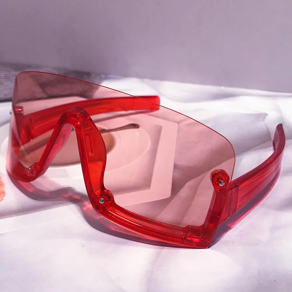 Oversized red and yellow shield sunglasses for women, trendy fashion sun shades with a bold, colorful design and hip hop style.
