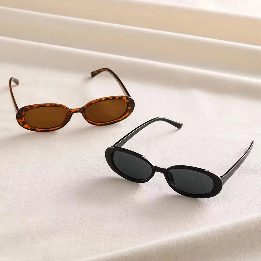 Vintage oval sunglasses for women by HSF Marketplace, black and red retro design with small oval frames.