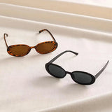 Vintage oval sunglasses for women by HSF Marketplace, black and red retro design with small oval frames.