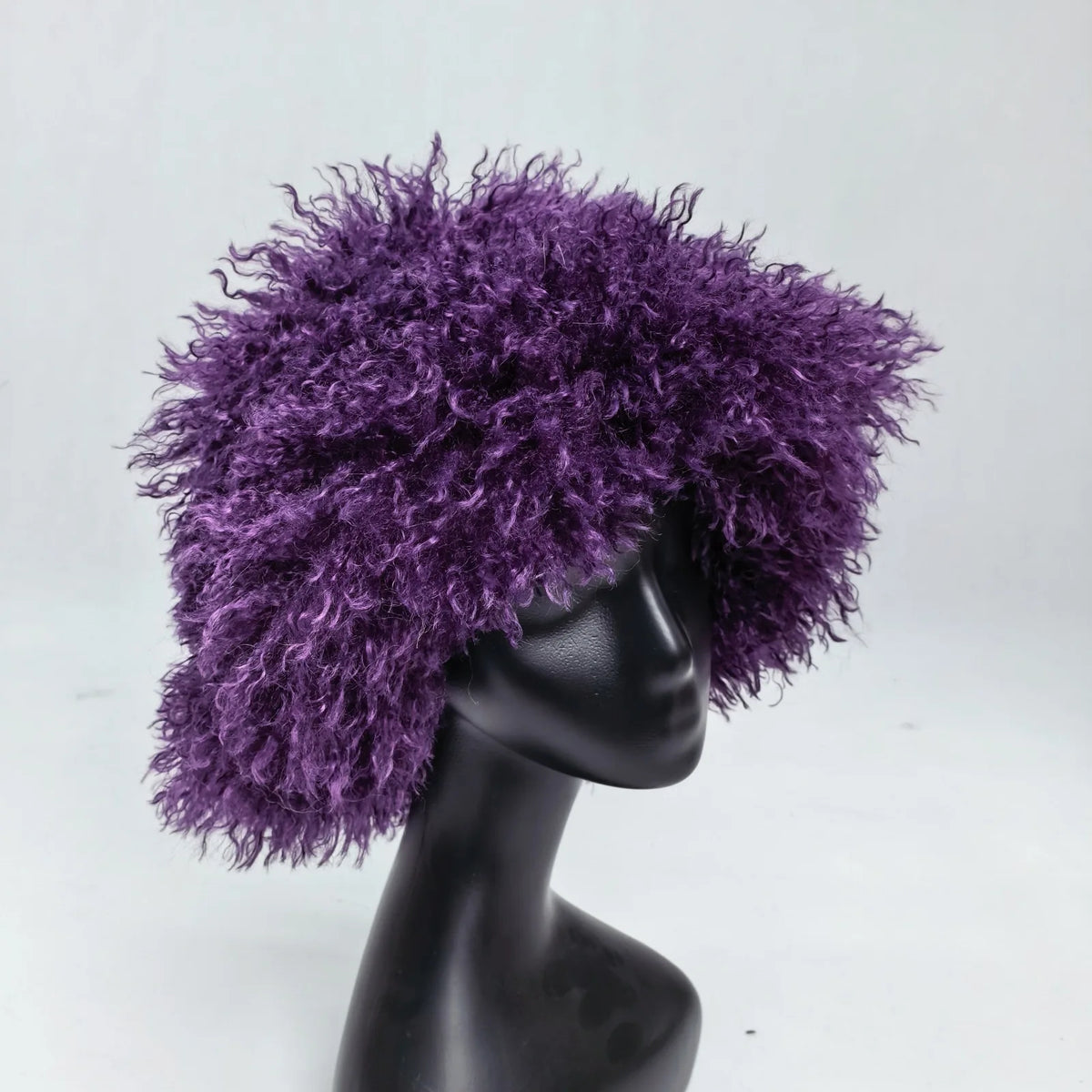 Women's trendy faux wool curly fur bucket hat by HSF Marketplace, plush textured design in close-up view