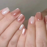 24-piece cute girly short square false nails with white French tips, glitter stars, rhinestones, cat eye, and bow art