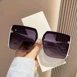 Vintage women's square sunglasses with large frames and retro style, featuring classic design from HSF Marketplace.