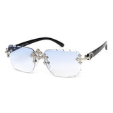 Square rimless sunglasses for women with diamond rhinestone accents, UV400 protection, and fashionable cut lenses.
