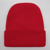 Unisex soft knitted winter beanie hat in a solid color, available in 24 color options