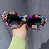 Oversized cat eye sunglasses for women with luxury crystal accents, retro style, by HSF Marketplace, featuring bold black frames.