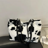 Large capacity women's winter shopper tote bag with cow print plush shoulder design, stylish handbag for travel and daily use.