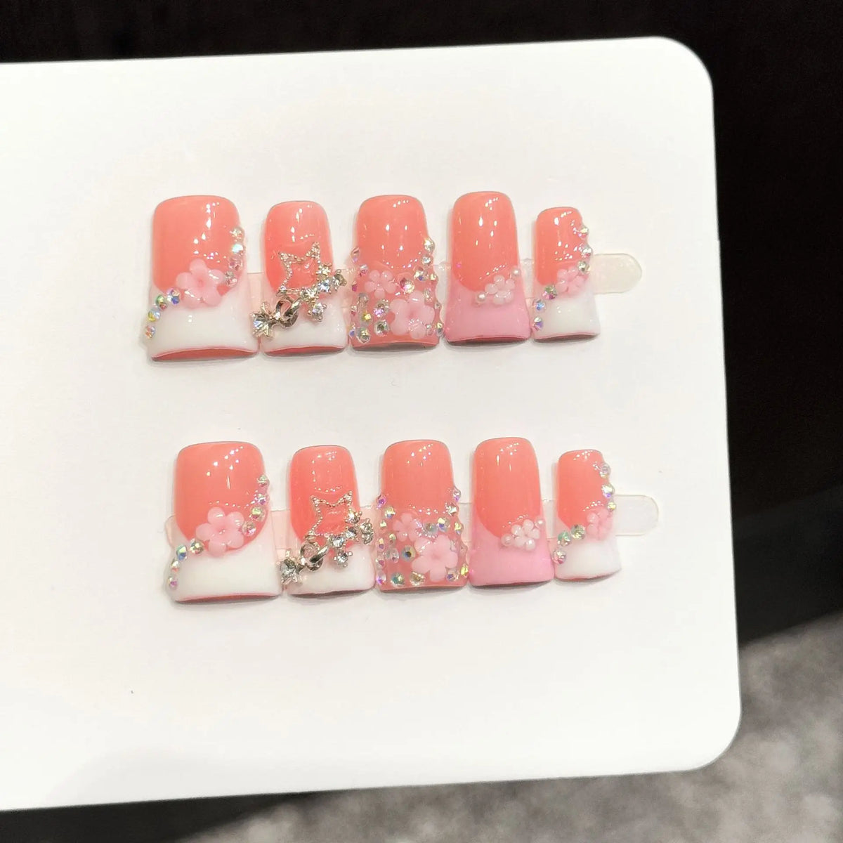 10pcs short duck bill press-on false nails with pink French tips, 3D butterfly flowers, pearl hearts, and rhinestones