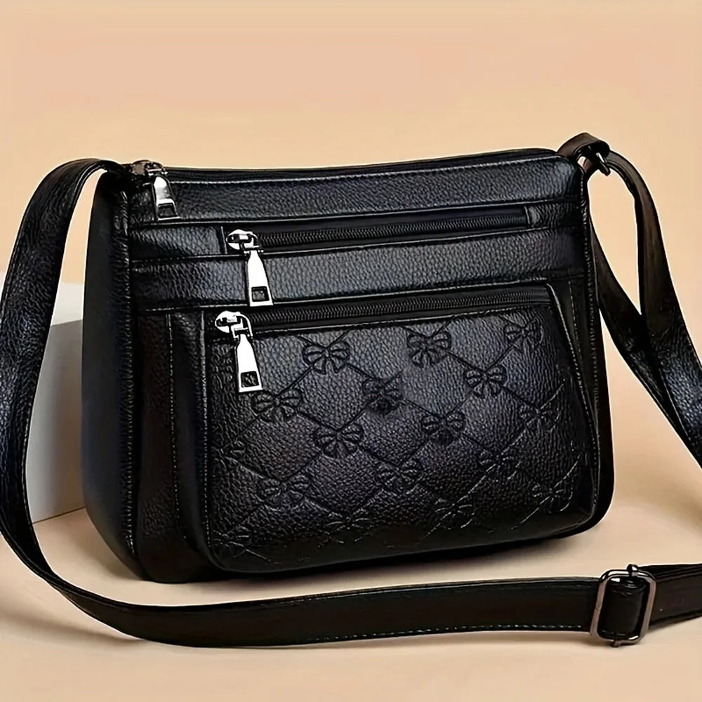 Black HSF Marketplace women's crossbody purse with embossed faux leather, large capacity, multiple pockets, ideal for outings or parties.