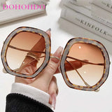 Women’s oversized oval frame sunglasses by HSF Marketplace with stylish design, UV400 protection, perfect for summer travel.