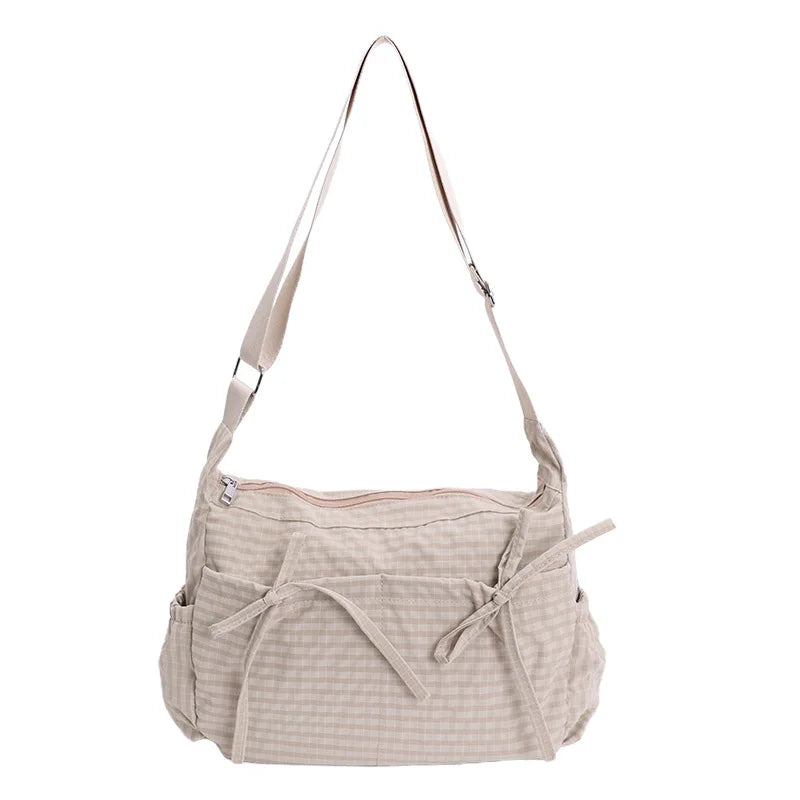 Women’s checkered nylon sling bag with drawstring closure, large capacity trendy crossbody handbag for shopping and casual outings.