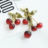 Vintage metal leaf and red resin cherry dangle earrings by HSF Marketplace