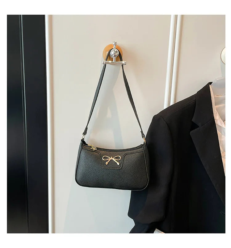 Ladies bow design underarm shoulder bag, stylish handbag by HSF Marketplace, perfect for fashion and everyday commute.