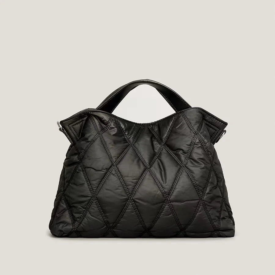 Housed in a quilted puffy design, this large-capacity designer women's shoulder bag features space down feather padding and warm winter style.