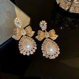 Elegant vintage gold bowknot dangle earrings for women by HSF Marketplace