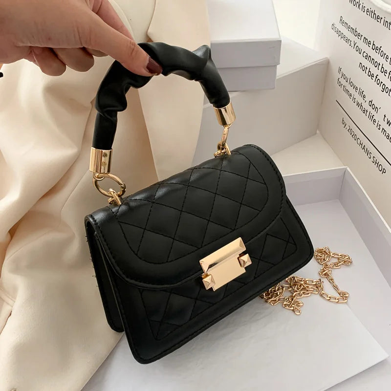 Luxury black PU leather underarm handbag for women, small shoulder purse with elegant design and compact clutch style.