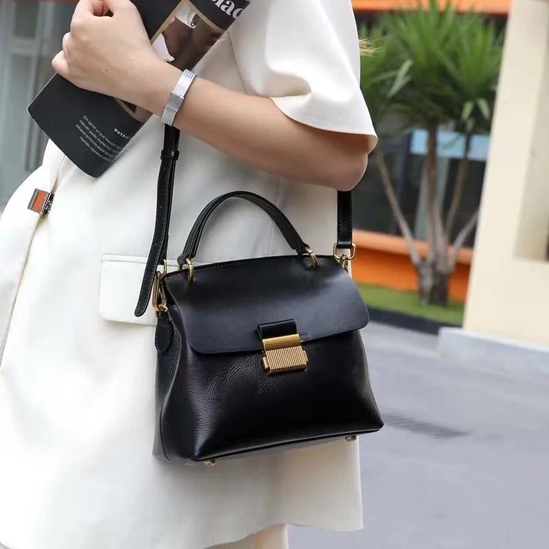 Vintage cow leather women’s handbag for commuters, structured design in rich brown leather