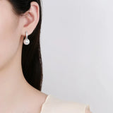 Stainless steel dangle earrings with pearl and zircon accents for women by HSF Marketplace