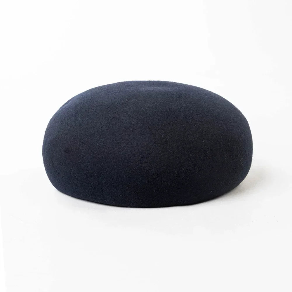 Women's vintage wool felt beret hat with hard concave top, pillbox-style design for weddings and cocktail parties