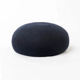 Women's vintage wool felt beret hat with hard concave top, pillbox-style design for weddings and cocktail parties