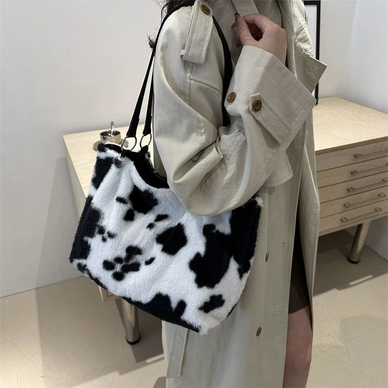 Large capacity winter travel tote bag for women with cow print plush shoulder strap, designed by HSF Marketplace, perfect for shopping and travel.