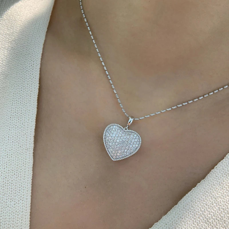 Huitan sparkling heart pendant necklace with cubic zirconia, elegant jewelry for women, perfect for wedding and special occasions.