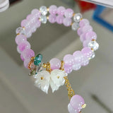 Colorful Lily Valley flower bracelet for women with crystal beads, elastic design, perfect for wedding and birthday jewelry.