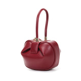 HIFASHION small genuine leather top handle handbag for women, elegant evening party pouch with round luxury design.