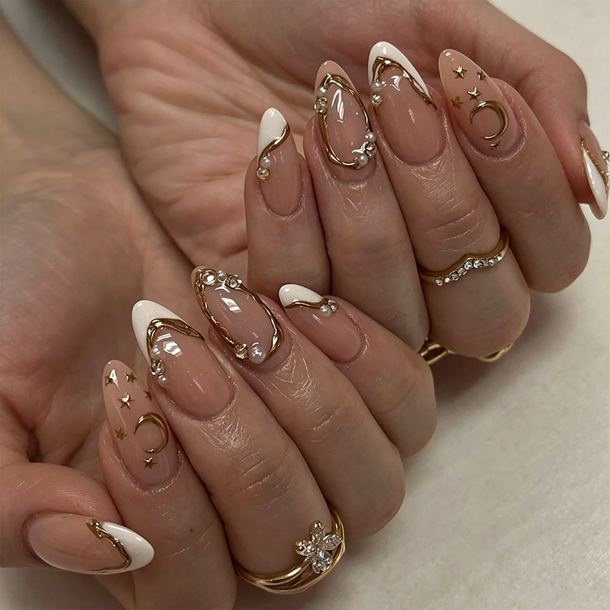 24-piece Y2K star press-on false nails with gradient blue French tips and gold moon designs, almond shape