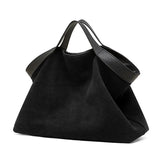 Genuine leather women's handbag with large capacity, shoulder strap, crossbody style, stylish cowhide tote for commuting and everyday use.