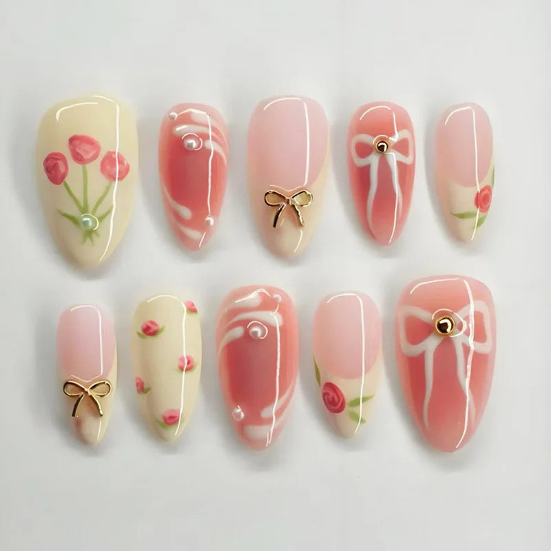 24-piece pink almond false nail tips with bowknots, love hearts, and pearl design by HSF Marketplace