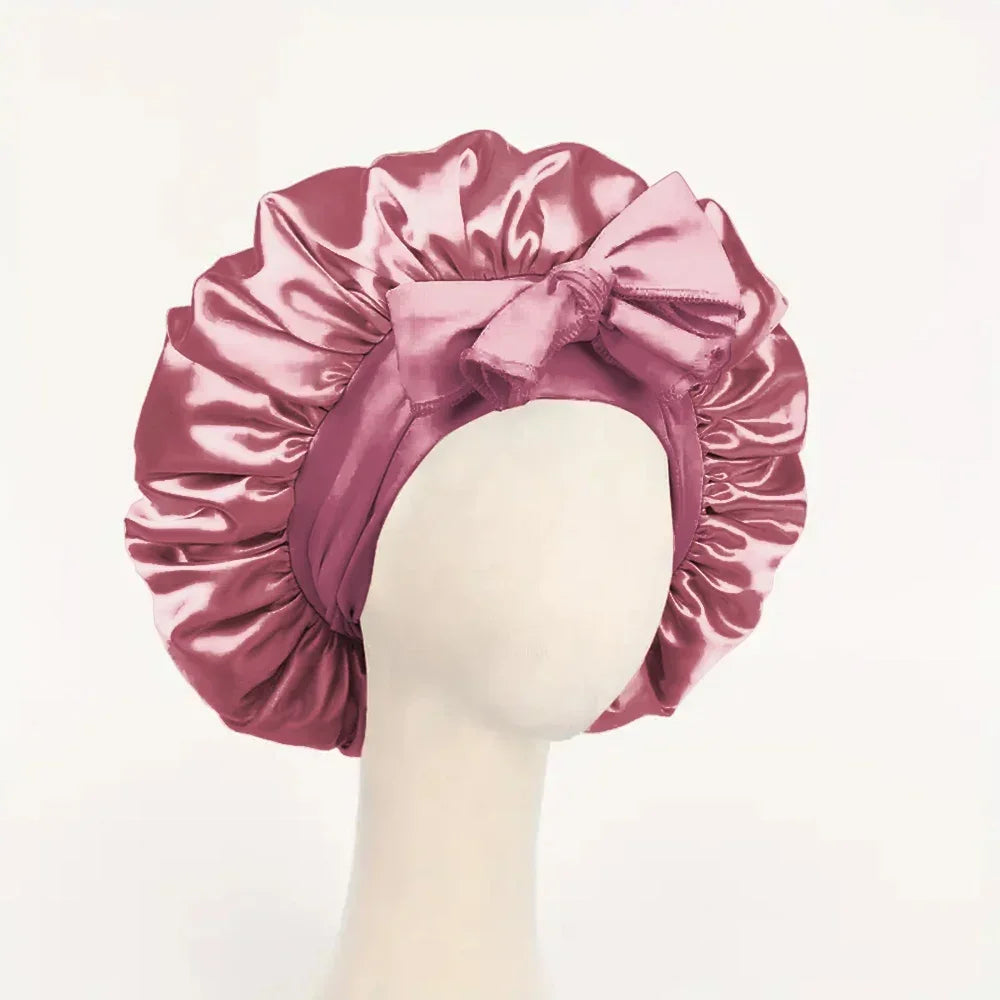 Silk satin adjustable sleep bonnet with tie band for women and men, used as a hair styling tool for protecting hair during sleep