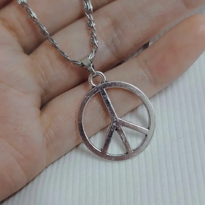 Hippie peace sign necklace in stainless steel for women, featuring a polished peace symbol pendant