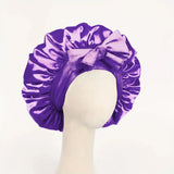Silk satin adjustable hair bonnet with tie band for women and men, ideal for sleeping and protecting styled hair.
