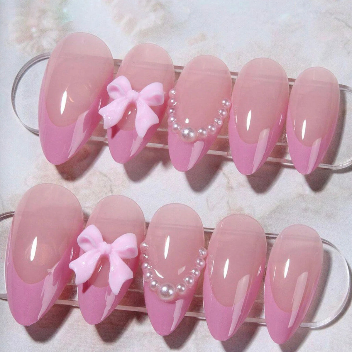 24-piece pink almond false nail patches with bowknots, love hearts and pearl design by HSF Marketplace