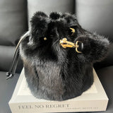 Luxurious real mink fur bucket handbag for women, fluffy evening bag with crossbody strap, perfect for winter luxury fashion.