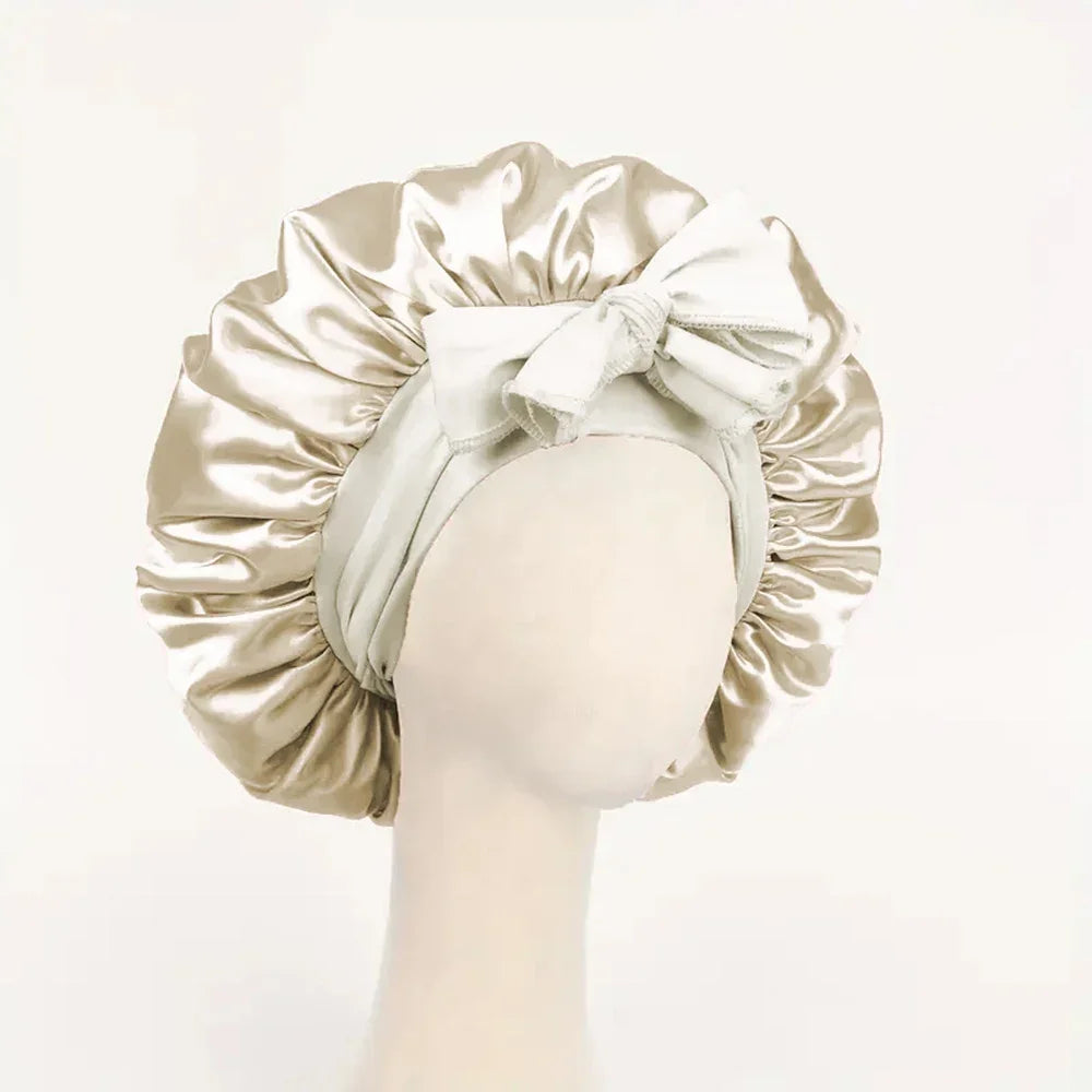 Silk satin sleep bonnet with adjustable tie band, suitable for women and men, designed to protect and style hair overnight.