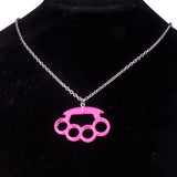 Resin imitation four-finger boxing glove pendant necklace with metal chain, stylish women's jewelry accessory.