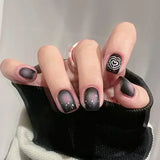 24-piece cute girly short square press-on false nails with white French tips, glitter stars, rhinestones, bows and cat-eye design