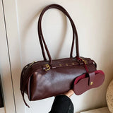 Fashion PU shoulder handbag with buckle decoration, large capacity, solid color, all-match design for women.