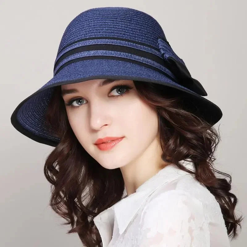 Muchique women's summer straw boater hat with wide brim, casual bow, and sun protection for beach travel