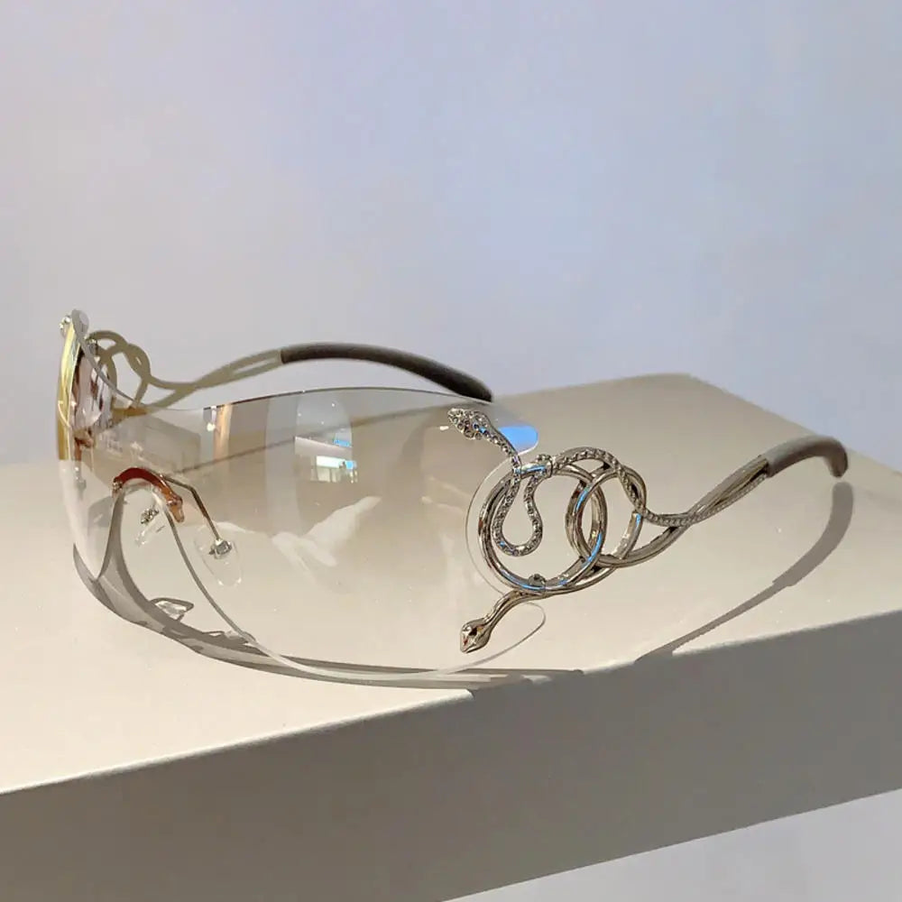 Y2k rimless sunglasses for women with snake-ray metal legs, gradient lenses, wrap-around style, stylish punk-inspired eyewear