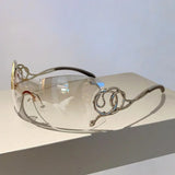 Y2k rimless sunglasses for women with snake-ray metal legs, gradient lenses, wrap-around style, stylish punk-inspired eyewear