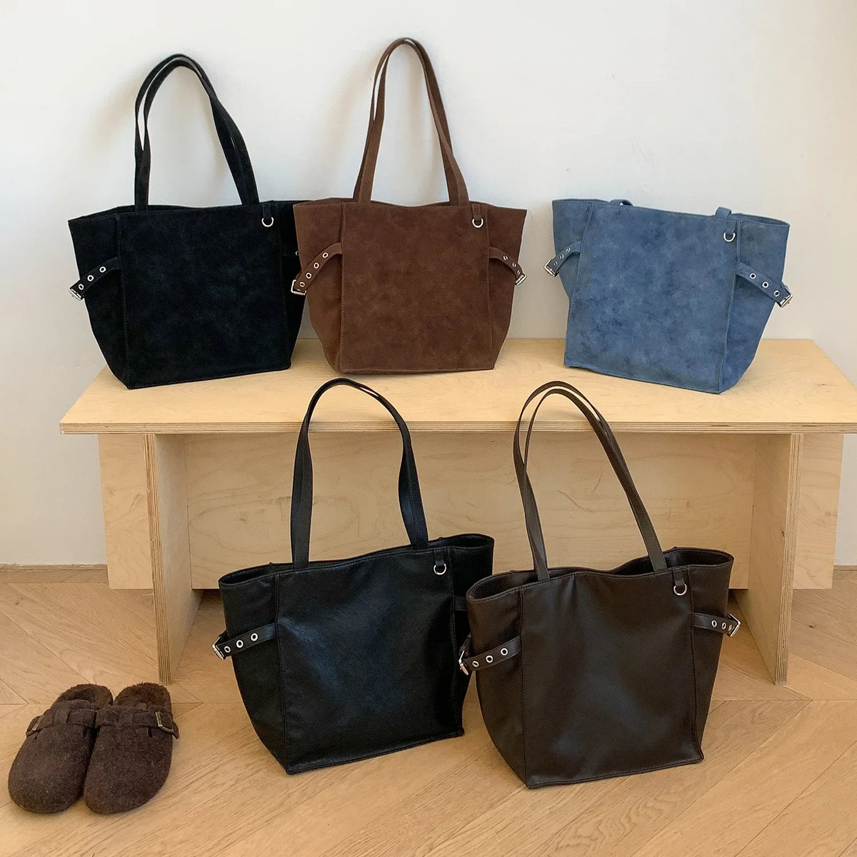 Black Rivet Design women's shoulder handbag with large capacity, elegant office style, featuring brand details and spacious interior.