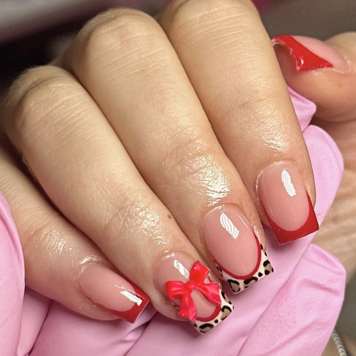 24-piece nude pink short duckbill false nails with leopard print French tips, 3D bowknots, butterflies and cherries