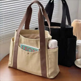 Large capacity canvas tote bag by HSF Marketplace, casual college-style shoulder bag for work, commuting, and carrying books.